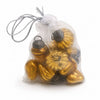 A clear plastic bag with 12 classic amber mouth-blown glass baubles featuring metallic caps and floral designs