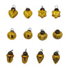 Small amber mouth-blown glass baubles shaped like hearts stars pumpkins acorns and teardrops with metallic caps