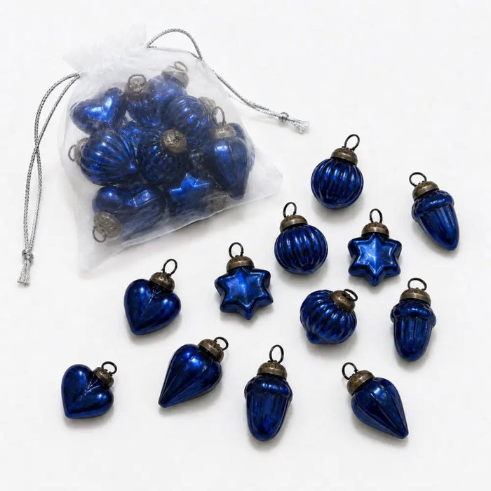 Set of small mouth-blown glass baubles in classic blue with metallic caps for christmas decoration use