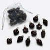 Small mouth-blown glass baubles in dark red with ribbed texture and brass-colored caps for christmas decor