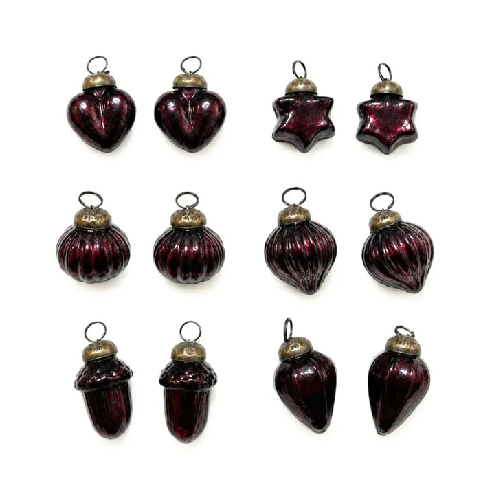 Set of twelve maroon mouth-blown glass baubles with brass caps and loops for holiday decoration