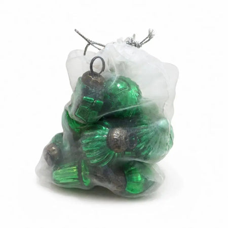A bag of 12 classic green mouth-blown glass baubles with metallic caps inside a sheer white drawstring bag