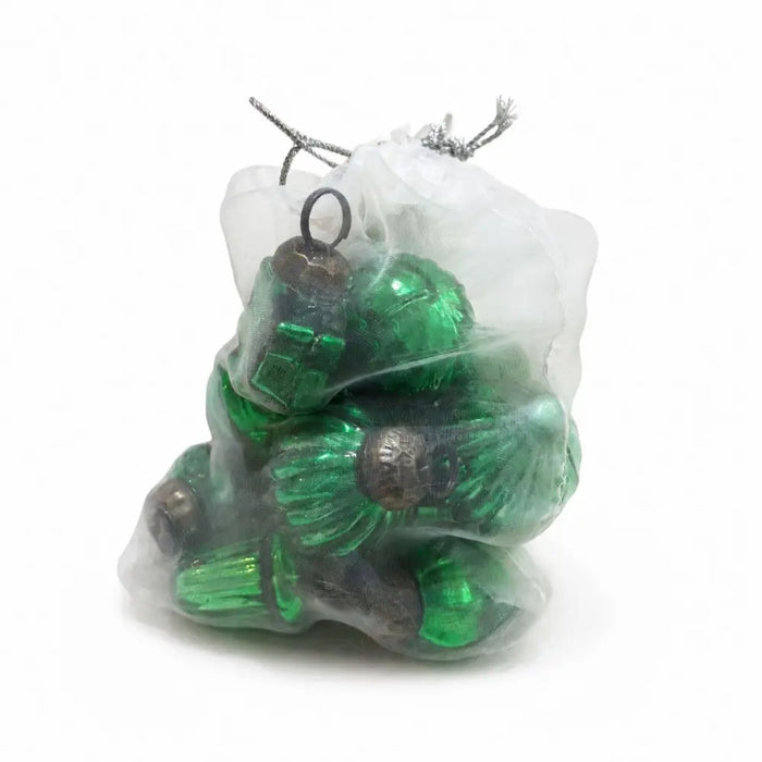 A bag of 12 classic green mouth-blown glass baubles with metallic caps inside a sheer white drawstring bag
