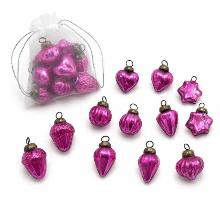 Small mouth-blown glass baubles in vibrant fuchsia with metallic gold caps and hanging loops in a bag of 12