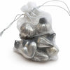 Small mouth-blown glass baubles in silver metallic shades nestled inside a sheer white organza bag