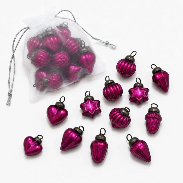 Fuschia mouth-blown glass baubles in heart star and teardrop shapes with metallic caps in a bag of 12