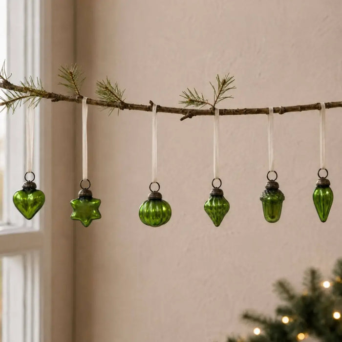 A set of five lime green mouth-blown glass baubles shaped as heart star sphere teardrop and acorn with metal caps