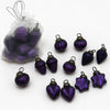 Small mouth-blown glass baubles in purple with metallic caps and loops for hanging as glass baubles on trees