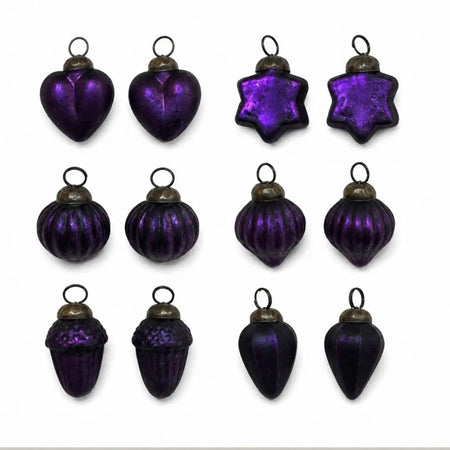 Set of twelve purple mouth-blown glass baubles in varied shapes with metallic caps including hearts and stars