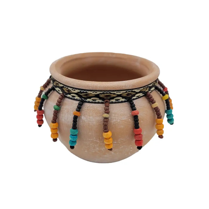 Small natural terracotta plant pot with black and cream band and colorful orange red teal brown yellow beaded tassels
