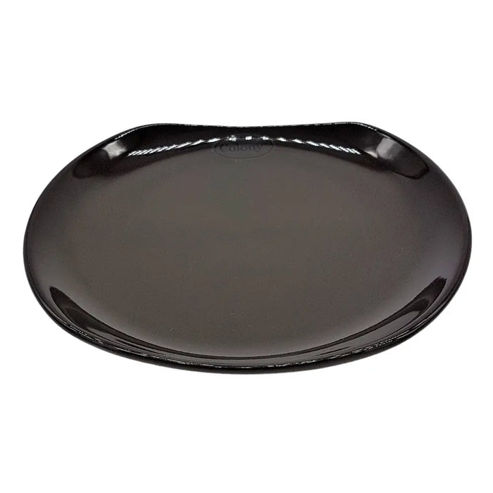 Small oval black ceramic plate with a glossy finish smooth rounded edges and a subtle embossed logo