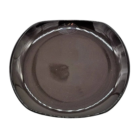 Small oval ceramic plate in shiny black with rounded edges and a glossy finish for serving or dining use