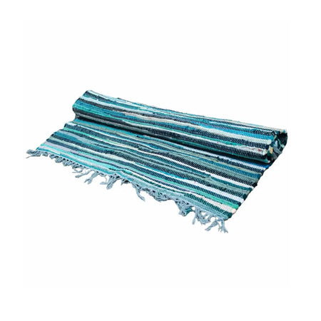 A rolled-up small rag rug in aqua blues with teal and white stripes and frayed edges made from woven fabric
