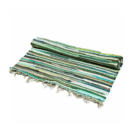 A rolled small rag rug with green and teal stripes and frayed edges in natural greens woven fabric