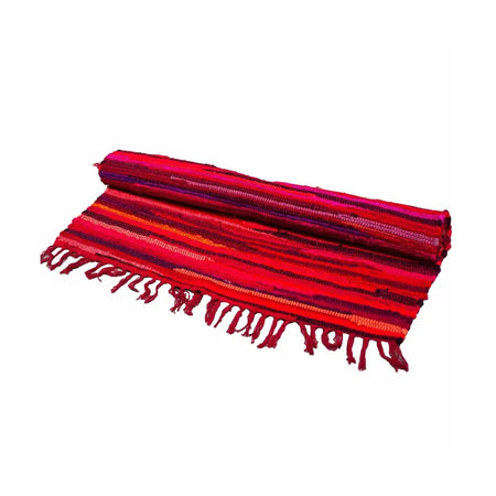A small rag rug with vibrant shocking pinks and red woven stripes and fringed edges made from cotton fibers