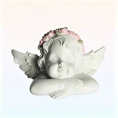 Small resting angel ornament with folded arms white resin and delicate pink floral crown with soft sculpted wings