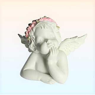 Small resting angel ornament in white with a smooth matte finish and a delicate pink floral crown resting on one elbow