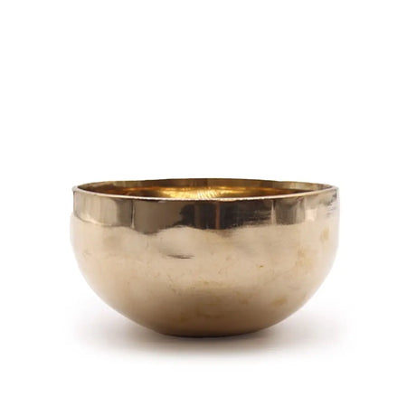 A hand hammered gold toned small shining bell metal handmade singing bowl with a textured rim b4b 466hz b4b