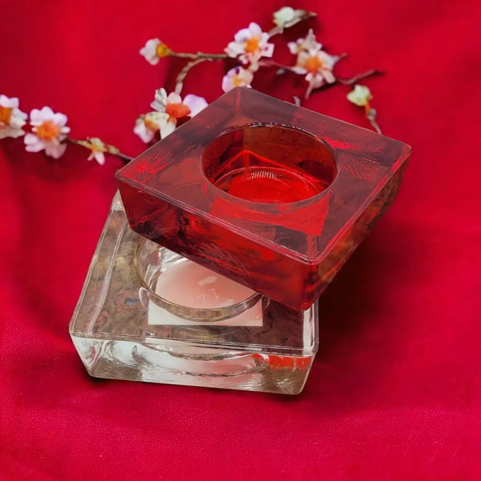 Small square glass tealight holder in red translucent glass with frosted texture and square design