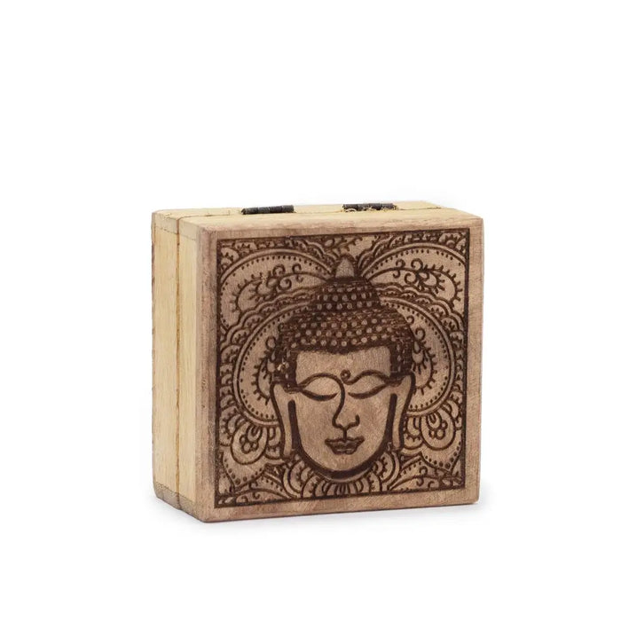Small square wooden box with a black engraved buddha face and intricate floral patterns on the lid