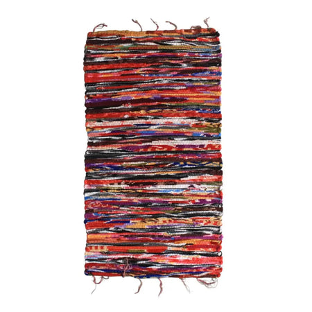 Small velvet dari rag rug made of handwoven multicolored yarn strips in red orange purple blue and black materials
