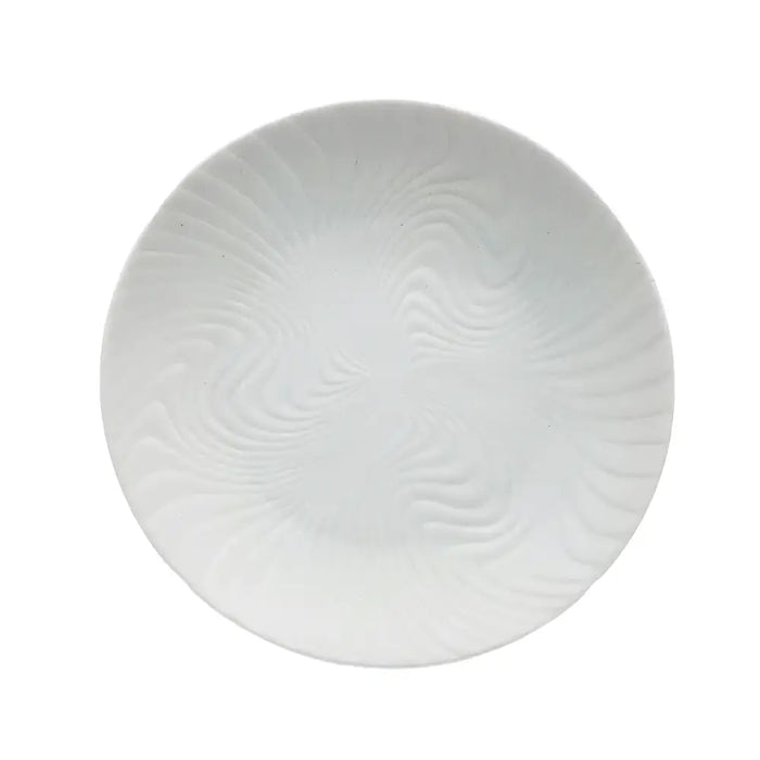 Small white porcelain plate with a subtle swirling textured pattern made of white porcelain ceramic