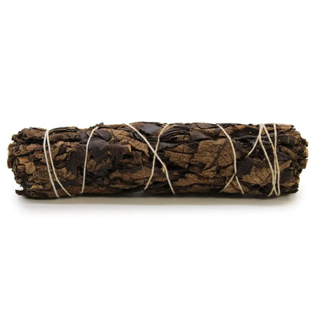 A tightly bound bundle of black sage leaves tied with natural twine used as a 15cm smudge stick