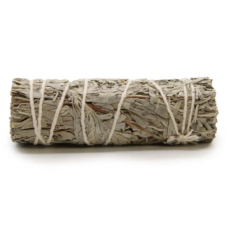 A tightly bound smudge stick of dried blue sage leaves tied with natural twine measuring about 10cm long
