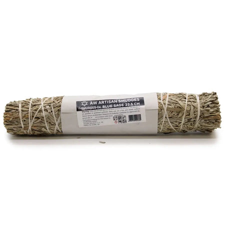 A bundled blue sage smudge stick wrapped in natural twine with an aw artisan smudges label on a white paper band