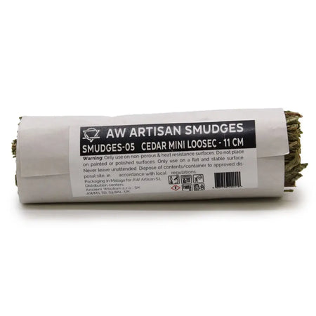 A cedar mini loosec smudge stick 11 cm wrapped in white paper with a black label showing usage details