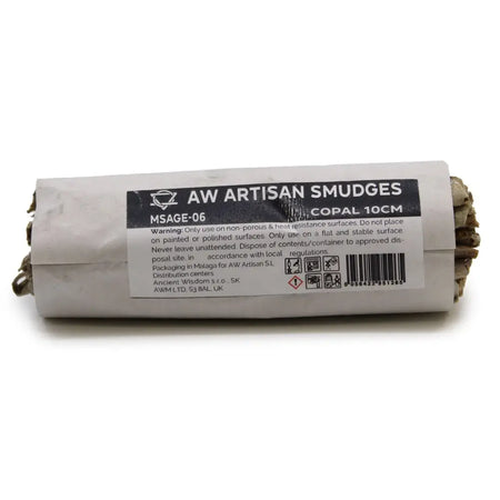 A rolled bundle of earthy-toned natural copal incense sticks wrapped in white paper with a black aw artisan smudges label