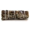 A smudge stick of dried copal sage tied with white twine showing beige and dark brown hues measuring 10cm