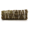 A tightly bound smudge stick of dried desert sage tied with light twine measuring about 10 cm long