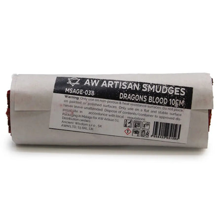 A roll of dragons blood smudge stick wrapped in white paper with a black label showing usage and safety details