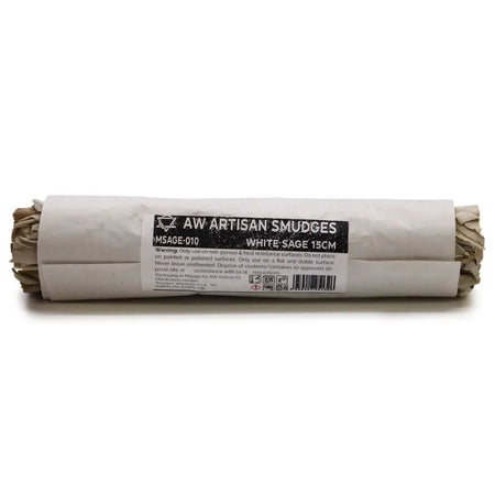 A rolled white sage smudge stick about 15cm long wrapped in paper with a black and white label