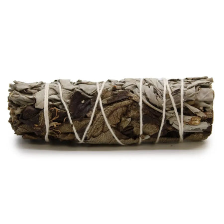 A smudge stick made of tightly bound dried white sage and black sage leaves tied with white twine