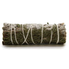 A tightly bound smudge stick of white sage and cedar tied with white twine known for purifying properties and clearing negative energy