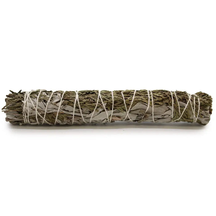 A smudge stick of white sage and cedar tied with white twine used for spiritual cleansing measures 22cm long