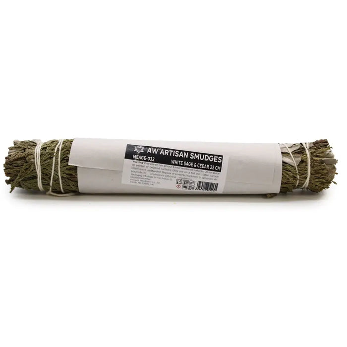 A bundle of white sage and cedar smudge sticks tied with twine for spiritual cleansing by aw artisan smudges