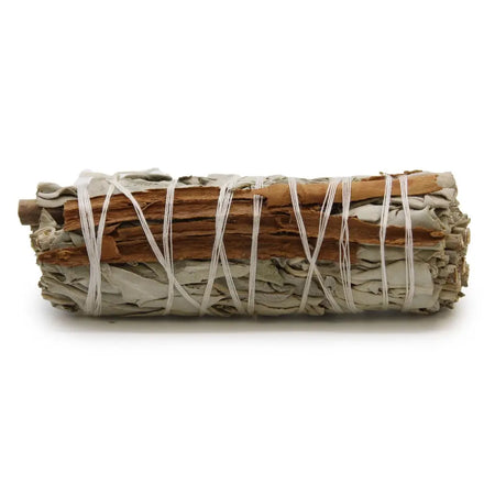 A smudge stick of dried white sage and cinnamon tied with natural twine measuring 10cm