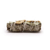 A tightly bound smudge stick of white sage eucalyptus and ginger leaves tied with thin white twine measuring 10cm