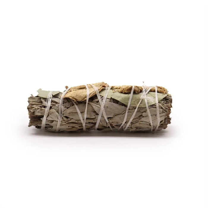 A tightly bound smudge stick of white sage eucalyptus and ginger leaves tied with thin white twine measuring 10cm