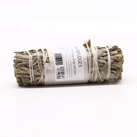 A bundle of white sage smudge sticks tied with twine labeled white sage ginger and cedar 10cm