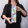 A rectangular flower gift box filled with colorful handcrafted soap flowers in blue pink green and purple shades