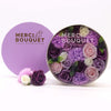 A round lavender soap flower gift box filled with purple pink and white rose carnation soap flowers