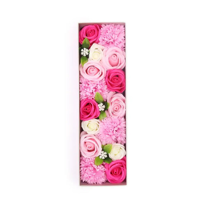 A rectangular soap flower gift box with pink magenta and white soap flowers for baby blessings