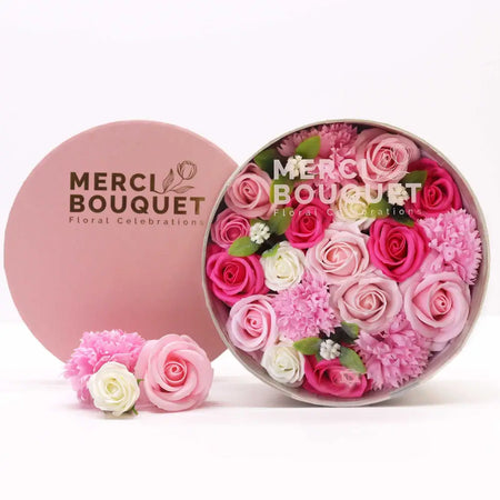 A round pink flower gift box filled with pink magenta and white soap flowers for baby blessings soap flower gift