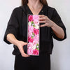 A rectangular flower gift box filled with pink white and fuchsia soap flowers arranged vertically for baby blessings