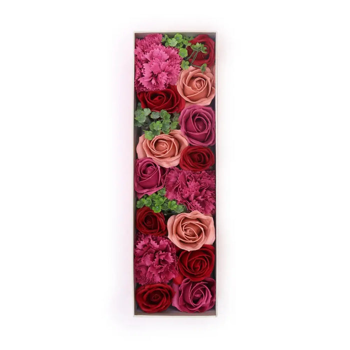 A soap flower gift box with vintage red roses in pink red and mauve shades accented by green foliage roses collection