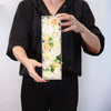 A rectangular white soap flower gift box with preserved cream ivory and pale peach roses and green leaves for wedding blessings